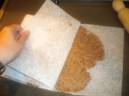 Roll out cracker mix between sheets of baking paper